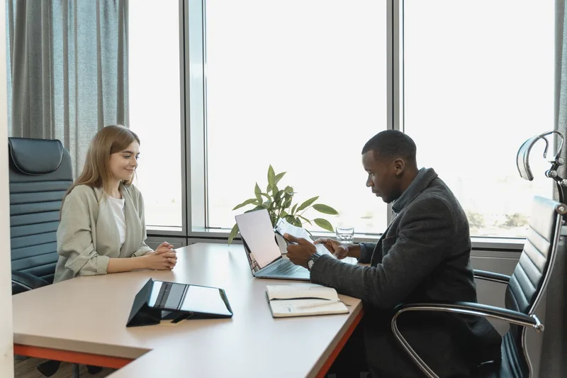 Two people reviewing a candidate