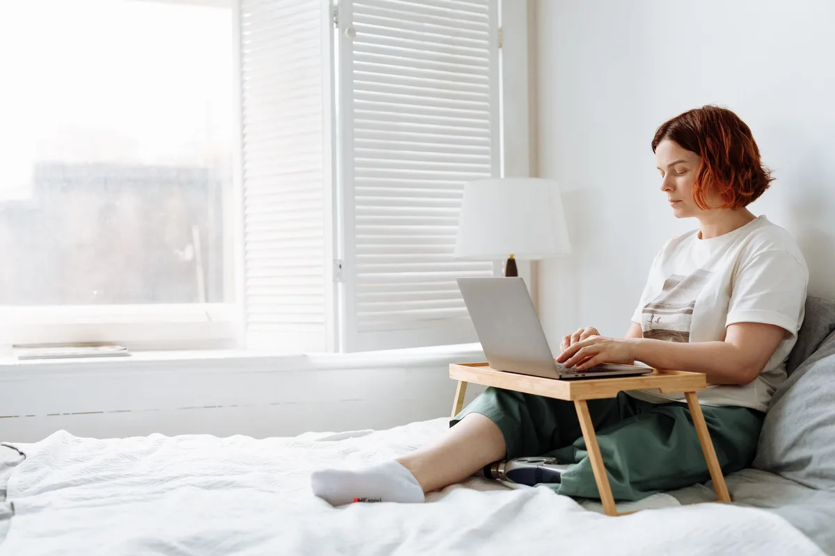 VA working from home reviewing a contract on a laptop