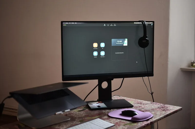 Home office setup with desk, laptop, and professional workspace for remote VA work