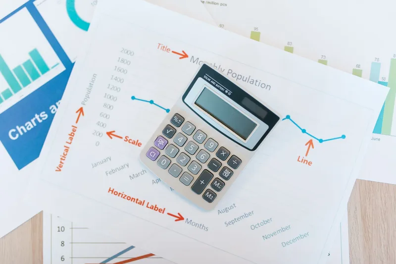 Bookkeeping VA reviewing a financial dashboard in QuickBooks Online with categorized transactions and monthly reports visible
