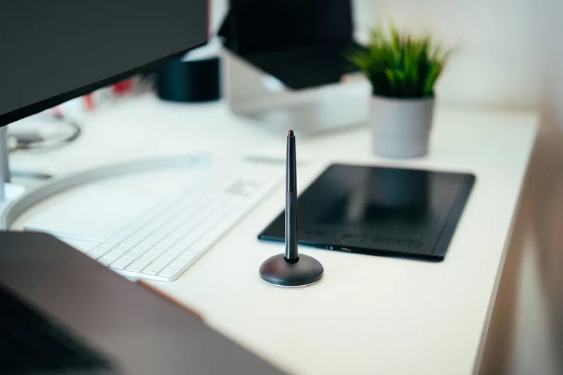 Organized tablet workspace and tools representing the systems that make a virtual assistant business run reliably