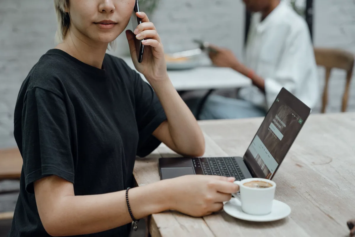 Solopreneur reviewing a VA rate comparison chart on their laptop at a home office desk