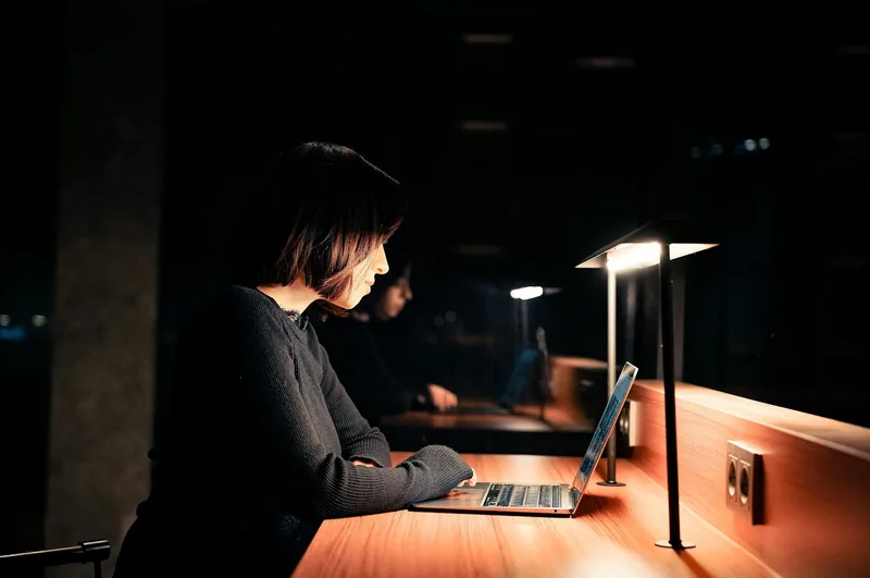 A remote worker focused on their computer, demonstrating the proactive VA mindset