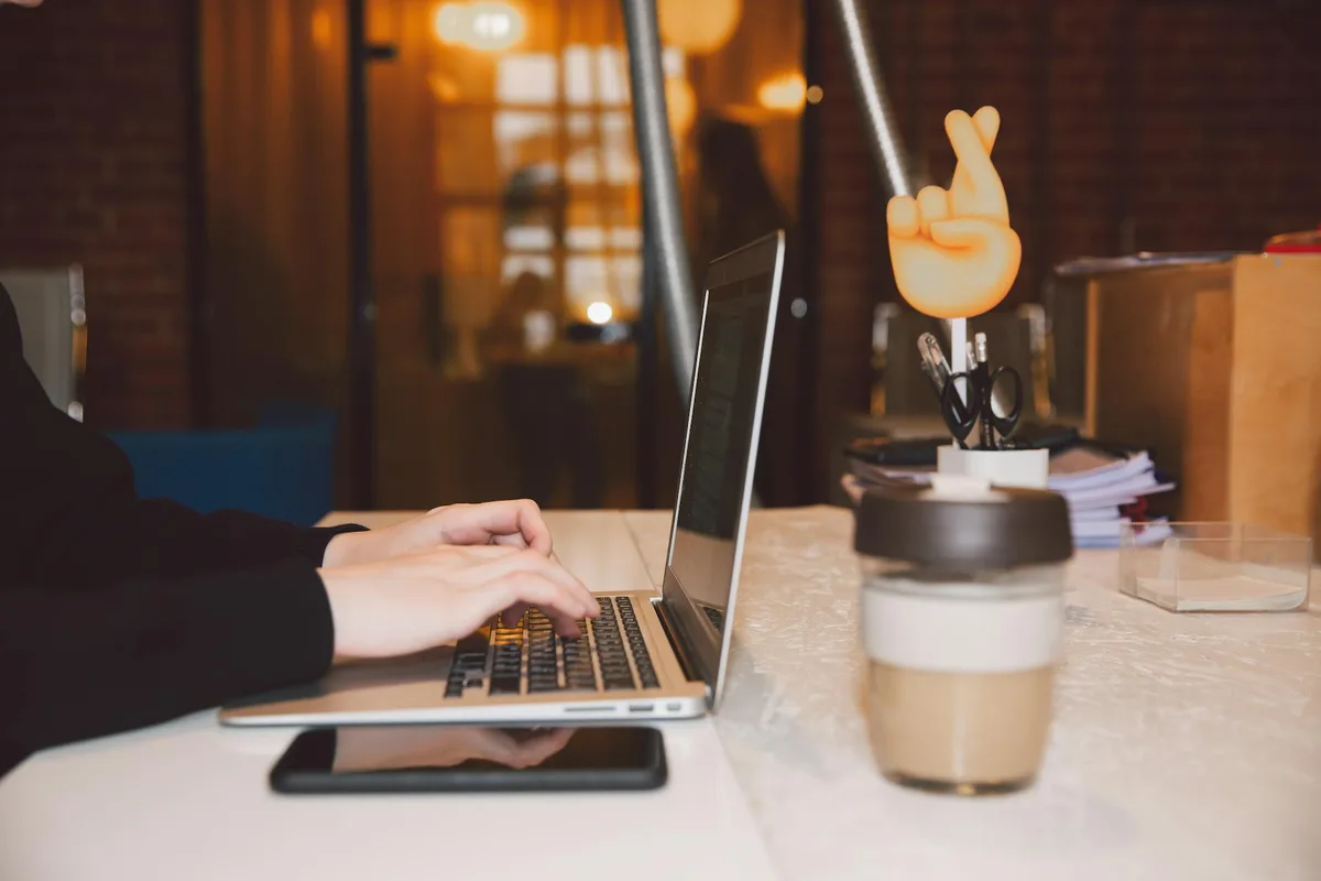 Virtual assistant working at laptop with project management dashboard visible