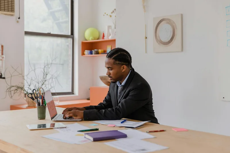 Business owner working calmly at desk, productive and organized