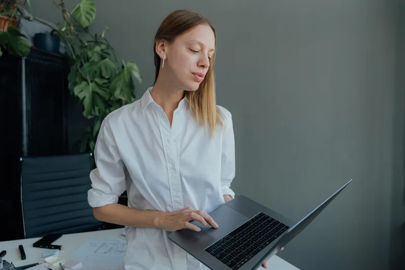 Remote virtual assistant working from home office with dual monitors