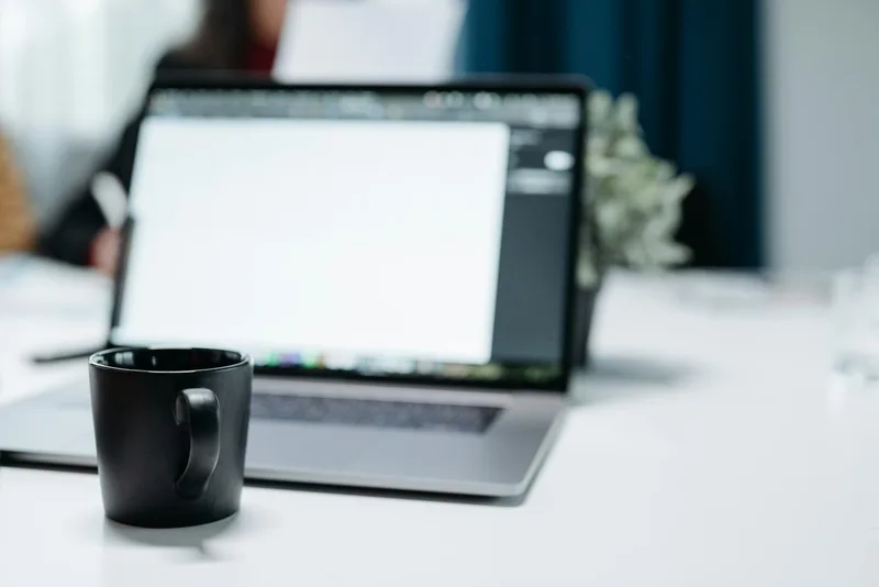 Side-by-side comparison: home office workspace versus corporate desk setup